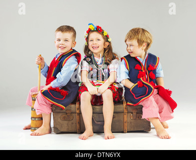 Joyful kids wearing national costumes Stock Photo