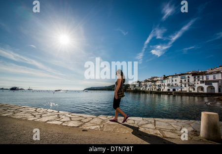 A visitor enjoys the view of the seaside artist's town of Cadaques, Cap de Creus peninsula, Costa Brava, Catalonia, Spain Stock Photo