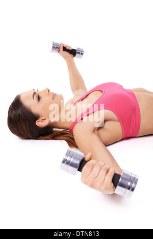 Woman working out using dumbbells Stock Photo