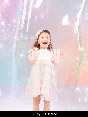 Cute little girl stucked in the large soap bubble Stock Photo