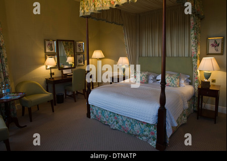 Bedroom with four poster bed at The Talbot Hotel in Malton North Yorkshire England UK Stock Photo