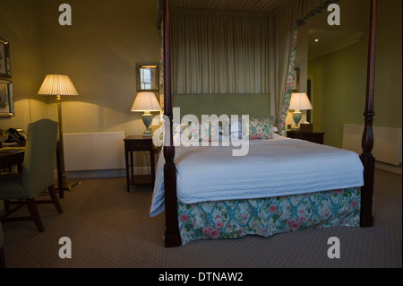 Bedroom with four poster bed at The Talbot Hotel in Malton North Yorkshire England UK Stock Photo