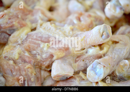 raw chicken legs with sauce Stock Photo