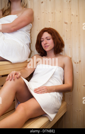 Women relaxing in sauna. Stock Photo