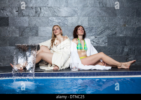 Women relaxing in wellness and spa swimming pool. Stock Photo