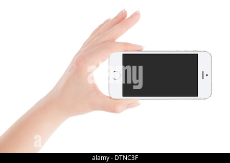 Female hand holding white modern smart phone with blank screen in landscape orientation. Isolated on white background. Stock Photo