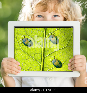 Child holding tablet PC Stock Photo