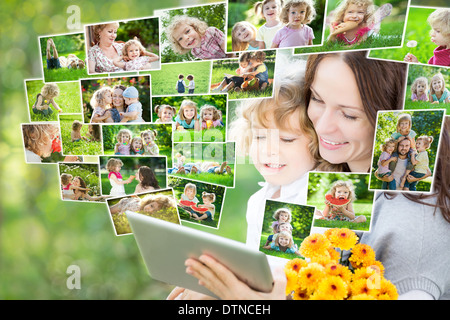 Happy family using tablet PC Stock Photo