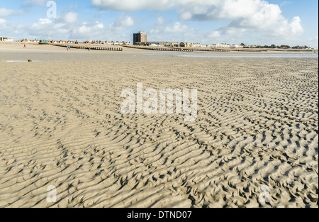 Ripples in the sand on an empty sandy beach. Stock Photo