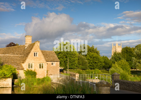 Old Mill and Church in the Cotswolds village of Fairford, Gloucestershire, England. Summer (July) 2010. Stock Photo