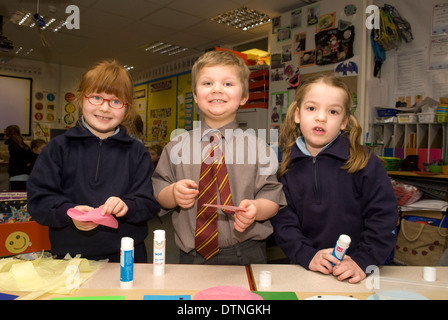 Primary school children undertaking crafts in classroom, Haslemere, Surrey, UK. Stock Photo