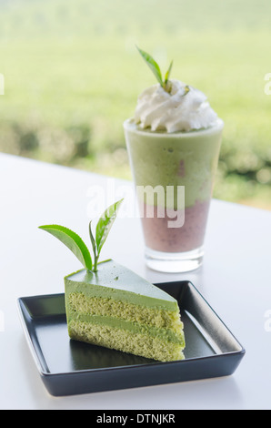 Green tea cake and smoothie with whipped cream Stock Photo