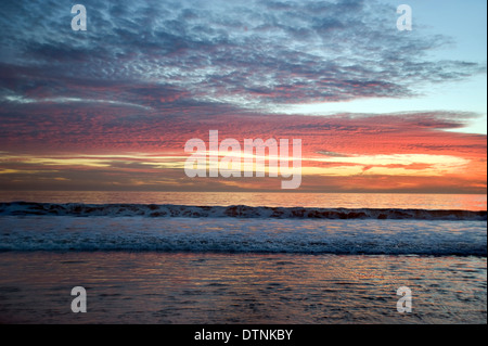 Colorful sunset sky over Pacific ocean Stock Photo