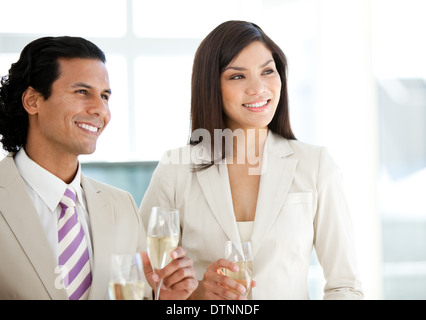 Successful business people drinking Champagne Stock Photo