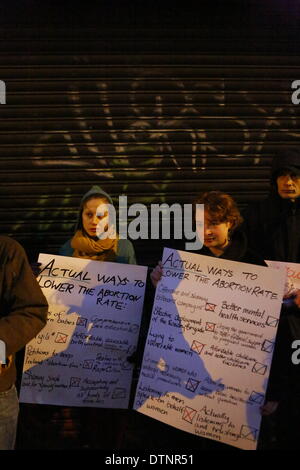 Dublin, Ireland. 21st February 2014. Protesters stand outside the pro-life counselling office. Irish pro-choice activists protested outside the counselling offices of Good Counsel Network Ireland in Dublin. The offices are located directly next to a Marie Stopes Centre, which provides pro-choice pregnancy counselling services. Credit:  Michael Debets/Alamy Live News