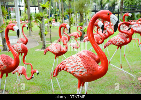 A beautiful group of flamingo sculptures at Nong Nooch Tropical Garden, Thailand Stock Photo