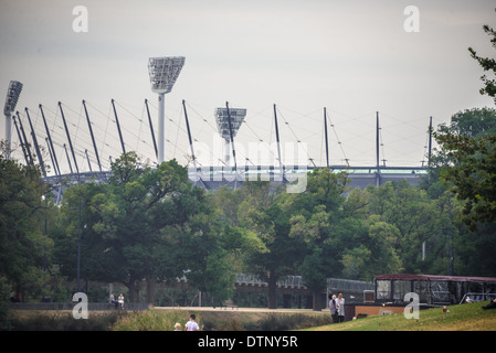 MCG Melbourne Cricket Ground from the yarra river showing the gardens and the lights of the venue Stock Photo