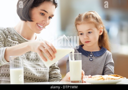 girl drinking milk at the kitchen Stock Photo