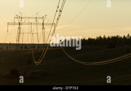 Power lines between transmission towers Stock Photo