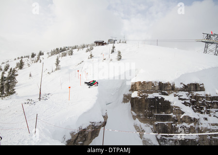 Skiers looking down corbet's couloir, a double black diamond skirun at ...