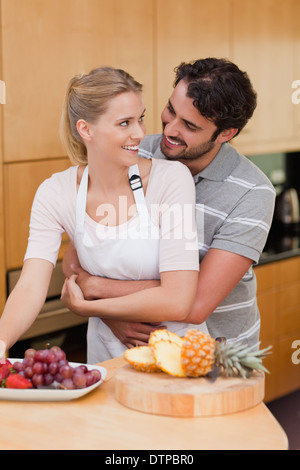 Portrait of a couple eating fruits Stock Photo