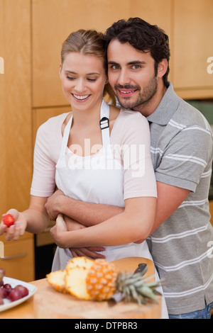 Portrait of an in love couple eating fruits Stock Photo