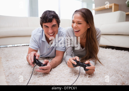 Couple playing video games together Stock Photo