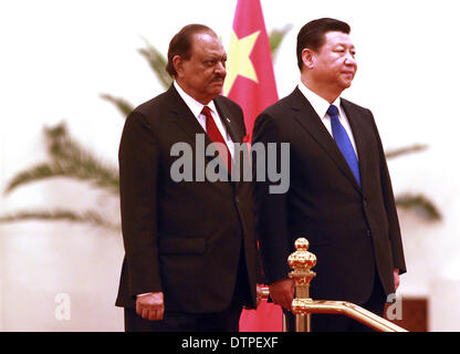 Beijing, CHINA, China. 19th Feb, 2014. Pakistani President Mamnoon Hussain (L) and Chinese President Xi Jinping attend a welcoming ceremony at the Great Hall of the People in Beijing on February 19, 2014. Longtime allies China and Pakistan signed bilateral agreements to build a new airport and upgrade a major highway between the two countries as part of efforts to build an ''economic corridor'' through mountains and a region prone to insurgent violence. © Stephen Shaver/ZUMAPRESS.com/Alamy Live News Stock Photo