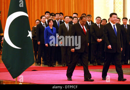 Beijing, CHINA, China. 19th Feb, 2014. Pakistani President Mamnoon Hussain (L) and Chinese President Xi Jinping attend a welcoming ceremony at the Great Hall of the People in Beijing on February 19, 2014. Longtime allies China and Pakistan signed bilateral agreements to build a new airport and upgrade a major highway between the two countries as part of efforts to build an ''economic corridor'' through mountains and a region prone to insurgent violence. © Stephen Shaver/ZUMAPRESS.com/Alamy Live News Stock Photo