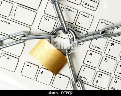 Computer keyboard locked with padlock and chain Stock Photo