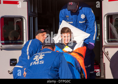 Newburg EMS EMTs loading a patient into an ambulance Stock Photo