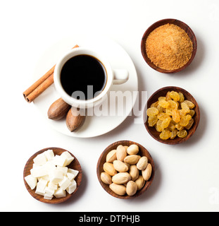 natural fruits with sugar nuts and coffee cup on white background Stock Photo