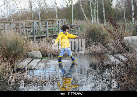 Child exploring at the WWT london wetland centre, in south West london, uk Stock Photo