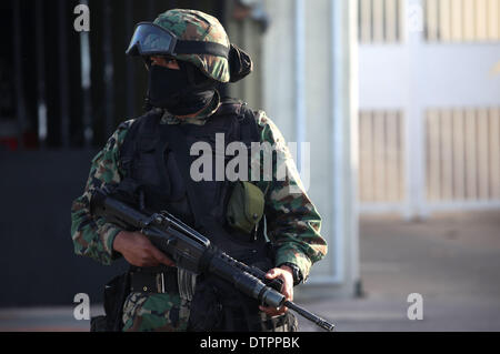 Sinaloa, Mexico. 22nd Feb, 2014. A Mexican Navy soldier guards a street in Mazatlan, Sinaloa, Mexico, on Feb. 22, 2014. The head of Mexico's Sinaloa Cartel Joaquin Guzman Loera, alias as 'El Chapo Guzman' who is considered by the United States as one of the most powerful drug lords in the world, was captured by Mexican and U.S. authorities in Mexican territory, according to local press. © Juan Perez/Xinhua/Alamy Live News Stock Photo