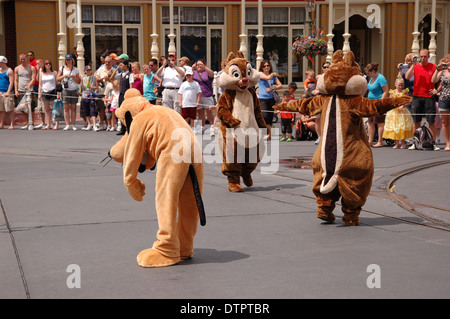 Performers dancing on the streets celebrating A Dream Come True Parade at Disney's Magic Kingdom, Walt Disney World, Orlando, U.S.A Stock Photo