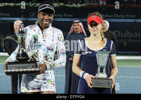 Dubai, United Arab Emirates. 22nd Feb, 2014. Venus Williams (L) of the United States and Alize Cornet of France pose for photograph during the awarding ceremony of their final match at the Dubai Tennis Championships in Dubai, United Arab Emirates, Feb. 22, 2014. Venus Williams won 2-0 to claim the champion. Credit:  Li Zhen/Xinhua/Alamy Live News