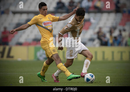 Mexico City, Mexico. 22nd Feb, 2014. Raul Jimenez (L) of America vies for the ball with David Cabrera of Pumas' UNAM during their match of the MX League Closing Tournament at Azteca Stadium in Mexico City, capital of Mexico, on Feb. 22, 2014. © Alejandro Ayala/Xinhua/Alamy Live News Stock Photo