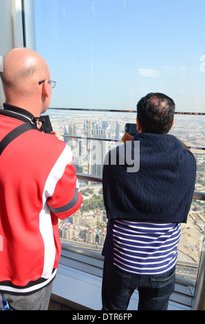 Looking out over Dubai from the observation deck of the Burj Khalifa, the world's tallest building. Stock Photo