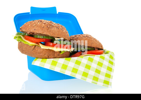 Healthy brown bread rolls in blue lunch box isolated over white background Stock Photo