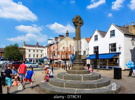 Shops and the Market Cross in the historic old Market Place, Knaresborough, North Yorkshire, England, UK Stock Photo