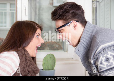 angry couple yelling at each other shouting face to face Stock Photo