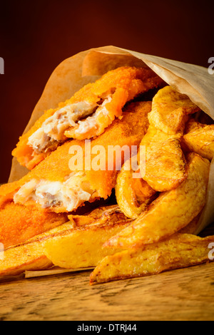 traditional fish and chips meal wrapped in paper Stock Photo