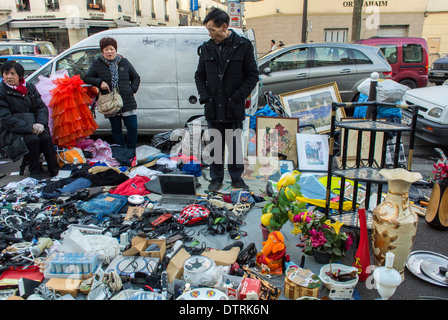 Paris, France., Small Crowd People, Immigrant Chinese Merchants, French Flea Market in Belleville Area, Immigrants Europe, Selling Used Products Parisian street scene people, low income neighborhood, paris chinese community, ChinaTown Belleville Stock Photo