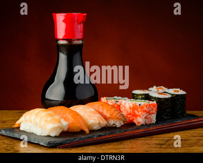 still life with mixed sushi plate, soy sauce and chopsticks Stock Photo