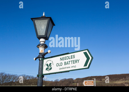 National Trust sign on lamp post at The Needles Country Park, Isle of Wight, pointing to Needles and Old Battery Stock Photo