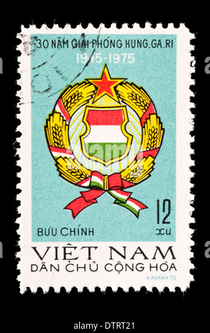 Postage stamp from North Vietnam depicting the national coat of arms. Stock Photo