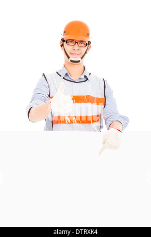 Male worker thumb up gesture and pointing to white board Stock Photo
