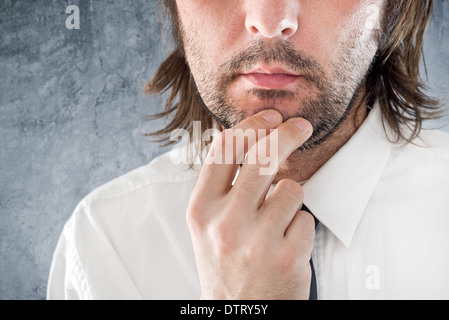 Businessman thinking. Portrait of thoughtful business person. Stock Photo