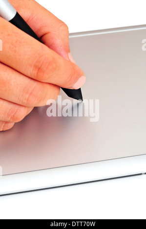 someone using a stylus in a graphics tablet Stock Photo