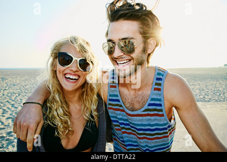 Couple smiling together on beach Stock Photo